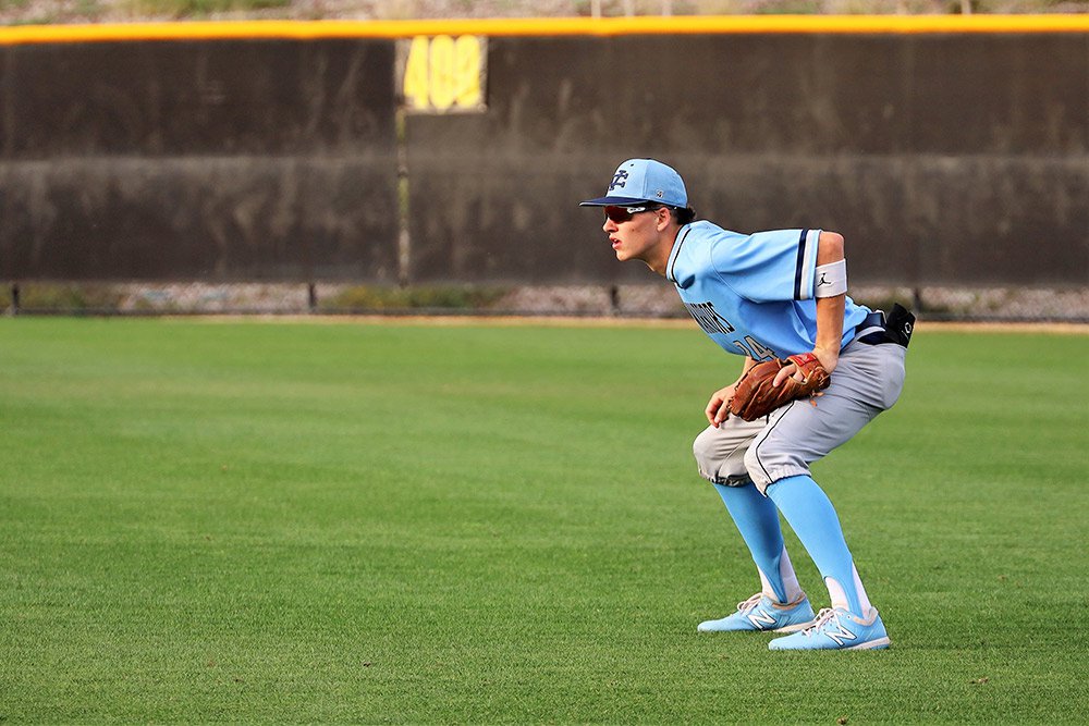 Student playing baseball